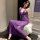 Woman wearing purple sheer bodysuit with lace trim, sitting on white fur stool. pure & seductive lingerie set - sheer modest ...