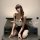 A woman poses seductively wearing a panda-themed lingerie set, featuring a cute bodice and black skirt, perfect for an elegan...