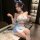 Woman wearing pure & seductive maid costume set - sexy cute lingerie sleepwear with blue bow, ruffles, and thigh-highs.