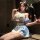 Woman in blue and white pure & seductive maid costume set, featuring ruffled top, short skirt, thigh highs, and cat ears.