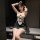 A woman poses in a black and white maid costume, featuring lace details and corset design, perfect for cosplay, date night, o...