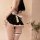 Pure & seductive maid costume featuring a black apron with white ribbon, ruffled skirt, and thigh-high stockings, perfect for...