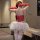Woman wearing red sheer bodysuit with heart detail, white tutu skirt, and long gloves from pure & seductive nurse costume set...