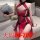 Woman in red silk qipao lingerie set with black trim, holding fan on sofa – plus size sensual cosplay outfit.