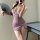 A woman poses with a fan, wearing a sheer purple cheongsam dress featuring a high slit and floral accents, embodying vintage ...