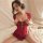 A woman poses elegantly in a luxurious red cheongsam dress set, featuring intricate lace detailing and a sexy bodycon fit, pe...