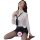 Woman wearing white sheer secretary-style lingerie set with black tie, mini skirt, and stockings in seductive pose.