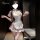 Woman in a white and plaid maid costume holding a teacup, showcasing the premium pure & seductive womens lingerie set for cou...