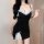 Woman wearing a black pure & sexy lace bodysuit with white lace trim and bow details, featuring a built-in padded bra.