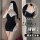 Woman modeling black lace bodysuit with sheer mesh and padded bra, perfect for lounge or nightwear.