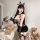 Woman wearing pure temptation lace bodysuit set with bunny ears and holding a riding crop, surrounded by teddy bears.