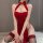 A woman wearing a red lace dress inspired by traditional chinese attire, featuring an open back and thigh-high stockings, exu...