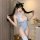 A woman poses wearing a blue and white striped open-crotch sleepwear set, featuring cat ears and thigh-high stockings, with t...