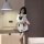 A woman poses in a navy collar bow skirt student lingerie set, featuring ruffled details and a playful design, perfect for fe...