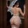 Woman wearing new pure & tempting lace bodysuit with sheer mesh and veil, showcasing sensual lingerie design.