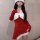 A woman wearing a festive santa hat and a red dress with white fur trim, perfect for holiday-themed cosplay or themed events.