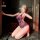 Woman in purple lace mesh sleep dress with open-crotch design, posing seductively while taking a mirror selfie.