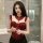 A woman models a red lace push-up corset vest set, featuring intricate detailing and a bow design, perfect for small bust wom...