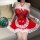 A woman wears a festive red and white christmas-themed maid costume, featuring lace details and bows, perfect for holiday sle...