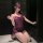 Woman kneeling in purple lingerie set with lace trim, blindfold, and high heels – pure & tempting open-crotch bodycon sleepwe...