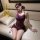 Woman in purple lace bodysuit and skirt sleepwear, styled as modest yet sexy lingerie for women.