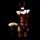Red bunny girl lingerie set with ears, bow, and open-crotch design on mannequin beside white roses.