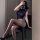 Woman in sleek navy top and beige secretary skirt posing on chair, showcasing pure & tempting lingerie set for nightclub or c...