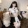 Woman in pure & tempting lingerie set - sheer cut-out bust bodycon mini skirt, nun-themed cosplay outfit, no-undress design.
