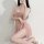 Woman wearing pink lace sleepwear set with sheer mesh cami and shorts, designed for small bust enhancement and sexy lingerie ...