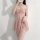 Woman modeling pink lace sleepwear set with sheer mesh cami and shorts, designed for small bust enhancement.