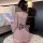 A woman sits on a fluffy rug, wearing a sensual purple sleepwear set inspired by hanfu. the off-shoulder, backless design fea...