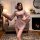 A woman poses elegantly in a sensual purple alluring lingerie set inspired by hanfu, featuring wide sleeves, an off-shoulder ...