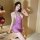 A woman poses elegantly in a purple deep v cheongsam lingerie set, featuring a sheer silk-like dress perfect for date night o...