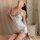 A woman poses elegantly in a purple floral lace sleep dress, featuring adjustable straps and soft satin trim, perfect for sum...