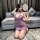 A woman poses elegantly in a sheer purple lace bodysuit set, featuring delicate buttons and a flowing tassel fan. the sensual...