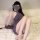 A woman poses on a fluffy white rug wearing a purple lace chinese-inspired sexy lingerie dress. the sheer overlay and halter ...