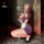 Woman in purple lace maid costume with sheer mesh panels, posing with phone. includes garter belt and gloves.