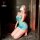 Woman kneeling in blue lace lingerie with bow detail, playful seductive style nightgown for small bust, no-remove design.