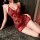 Woman wearing red lace seductive sleep dress with floral pattern and bow detail, playful lingerie nightgown style.