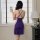 A woman stands by a window wearing a purple lace sheer mesh camisole nightgown, capturing herself with a phone. the dress fea...