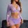 Woman wearing purple lace sheer lingerie set with long sleeves, v-neck top, and high-waisted bottoms.