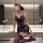 Woman wearing purple lace sheer sleep dress with cut-out details, posing in modern bathroom. sexy off-shoulder bodycon nightg...