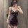 Woman wearing purple lace sheer sleep dress with off-shoulder bodycon fit and cut-out details, taking mirror selfie.