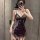 A woman poses in a purple lace sheer sleep dress, featuring an off-shoulder design and floral trim details. the bodycon fit a...