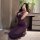 A woman poses in a luxurious purple sheer lace nightgown, featuring a seductive design perfect for date nights and sleep. the...