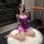 Woman wearing purple plus size lace bodysuit, sexy shapewear romper for nightclub and lingerie outfits, no-remove uniform sty...