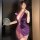 A woman poses with a purple silk-look sensual hanfu lingerie set, featuring a deep v-neckline and floral accents, paired with...
