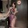 A woman poses elegantly in a luxurious bathroom, wearing a purple high-slit cheongsam lingerie set. the sheer design features...