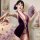A woman poses with a purple velvet cheongsam lingerie set featuring sheer backless design and no-remove feature, exuding eleg...