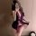 Woman in purple velvet qipao lingerie set with floral tie-back, sheer sleeves, and deep v-neckline. seductive sleepwear for w...